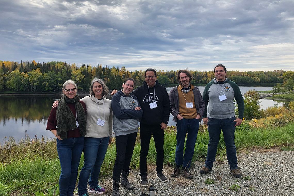Pamela Klassen, Cara Krmpotich, Mikinaak Migwans, Alan Ojiig Corbiere, Bradley Clements and James Migwans at Manitou Rapids, Rainy River First Nations (photo courtesy of GRASAC)